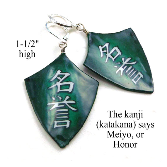 paper earrings that say Meiyo or Honor in Japanese katakana