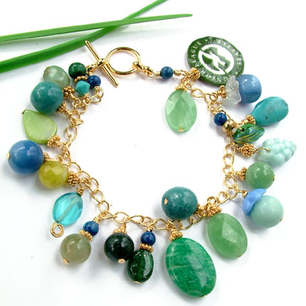 custom designed gemstone charm bracelet with Junior League Seattle logo