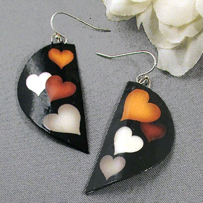 black earrings with hearts in white, grey, tan and rust