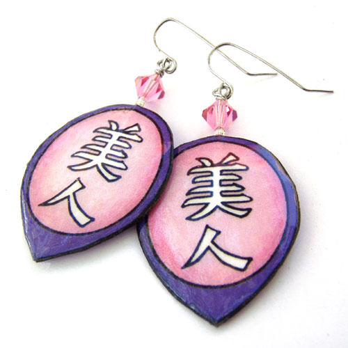 pink and purple lacquered paper earrings with the japanese kanji bijin, or beautiful woman