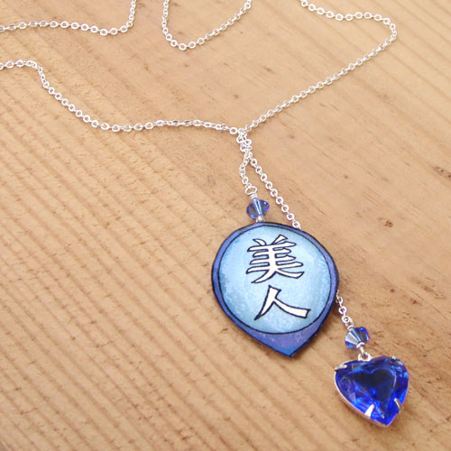 sapphire heart vintage glass rhinestone jewel lariat necklace with the japanese kanji bijin, or beautiful woman