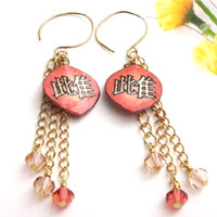 paper earrings with the kanji mesu - female animal, or bitch...shown in coral with Swarovski crystal dangles