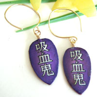 purple paper earrings with the Japanese kanji kyuuketsuki, which means Vampire