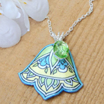 lacquered paper necklace in green, blue and cream with vintage peridot glass jewel