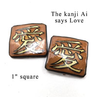 lacquered paper kanji clip on earrings that say Love in Japanese kanji