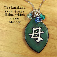 green necklace with Swarovski crystal elements says Mother in Japanese katakana