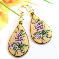 paper earrings with pink roses and yellow background