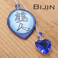 kanji necklace with a sapphire vintage glass rhinestone heart jewel and the japanese kanji that says Bijin...with Swarovski crystals