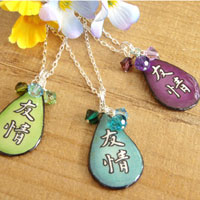 Lacquered paper japanese kanji friendship pendant accented with swarovski crystals
