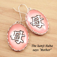 pink oval glass and paper earrings with the Japanese kanji haha, or Mother